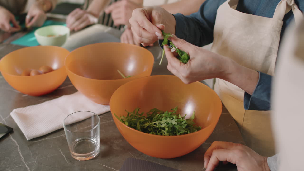 Tearing Arugula Leaves While Cooking