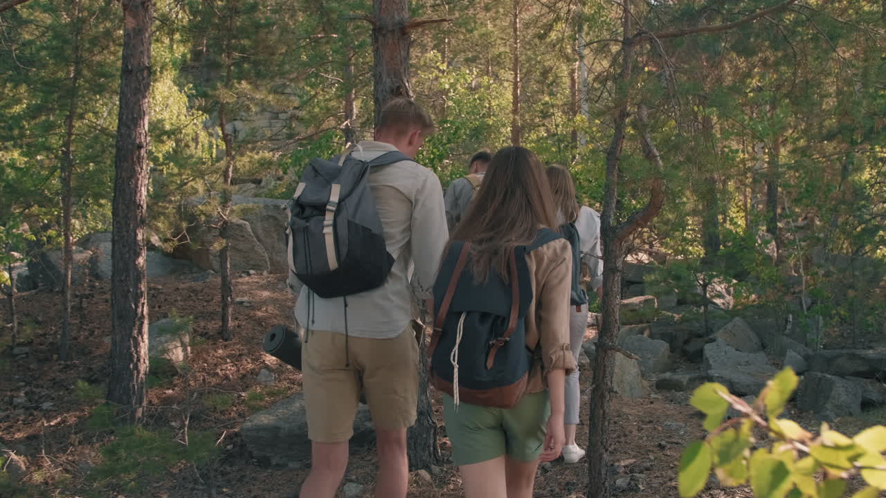 Young Couples Hiking in Woods