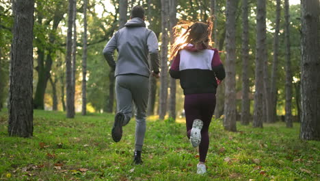 couple jogging in forest
