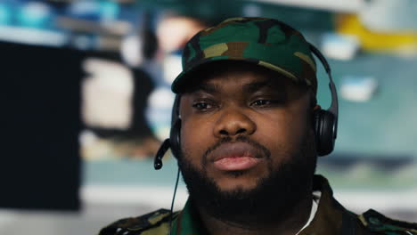 african american army personnel transmitting information on headset