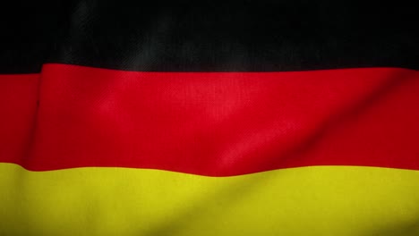 die deutsche flagge schwingt im wind.