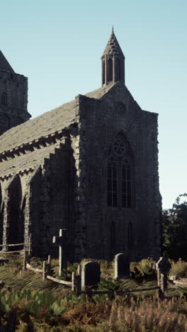 stone church with graveyard