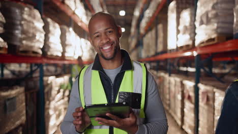 warehouse worker using tablet in warehouse