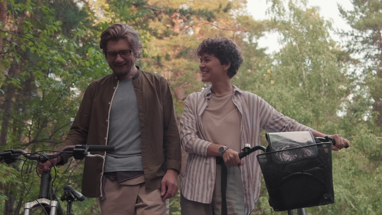 Young Couple On Walk With Bikes