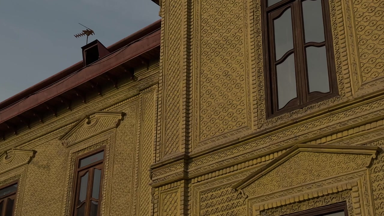 Brick facade with traditional design of wooden window urban architecture Tehran Iran historic building pattern downtown street Islamic Persian heritage cultural landscape rooftop city sunset tourism