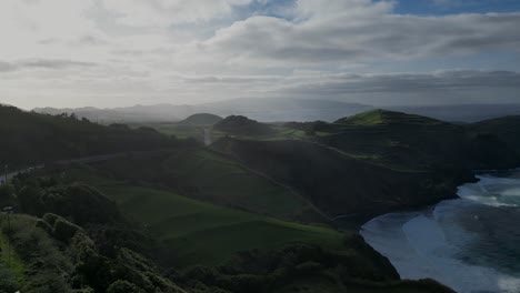 Wide-panning-view-of-the-high-green-mountains-at-the-Azores-on-a-partly-cloudy-day