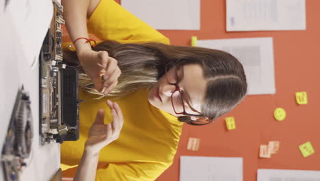 Vertical-video-of-Seriously-smart-girl-child-focused-on-tech-stuff-gets-frustrated.