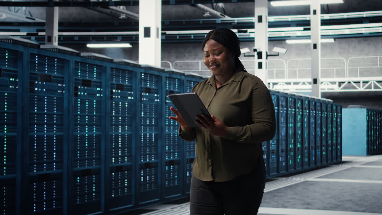 Data center admin monitoring data center metrics on tablet