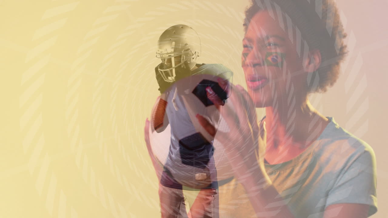 Football player in helmet running over cheering fan with face paint