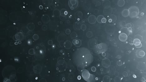 bokeh de partículas abstractas flotantes sobre fondo oscuro