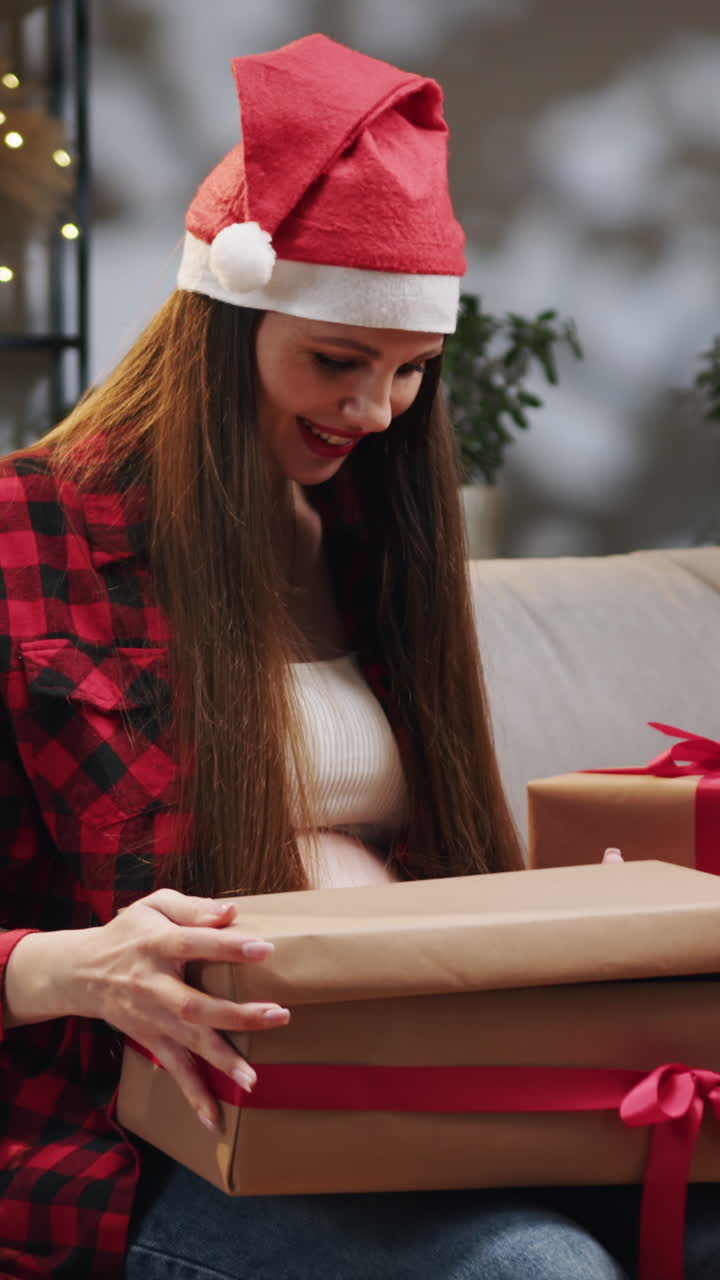 Woman opening christmas presents