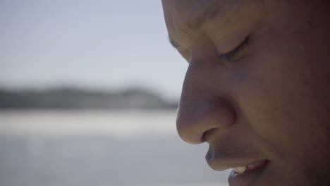 side view of smiling african american man outdoor.