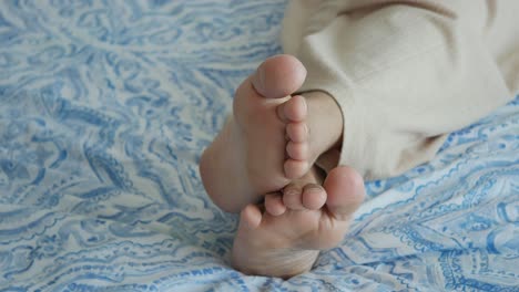 woman's feet on a bed