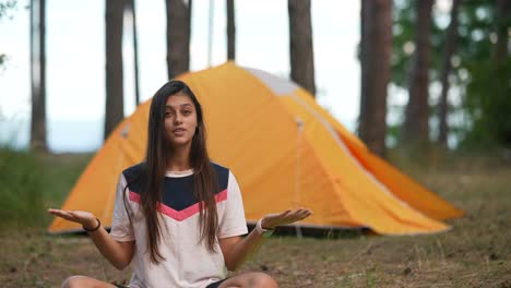 teenager camping in forest