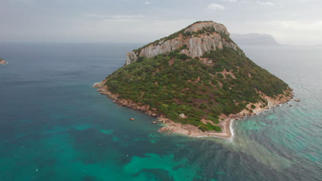 mediterranean wonders: figarolo's aerial dance with azure waters and the majestic mountain