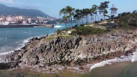 Drone-aerial-view-of-the-San-Nicolás-island-at-the-beach-of-Lekeitio-in-the-Basque-Country