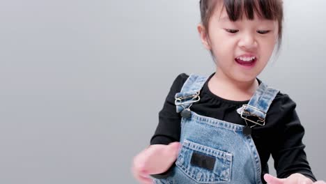 child showing notebook with drawing made by her