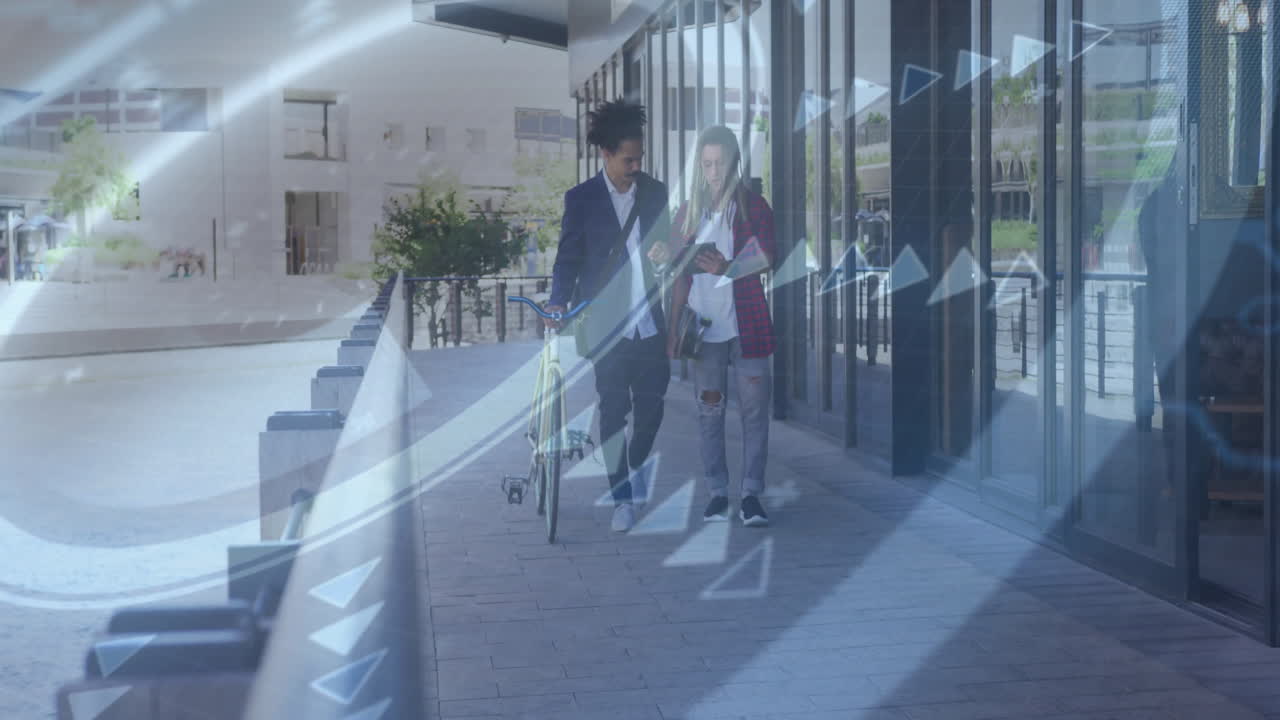 Two people walking with bicycles, digital data animation overlaying scene