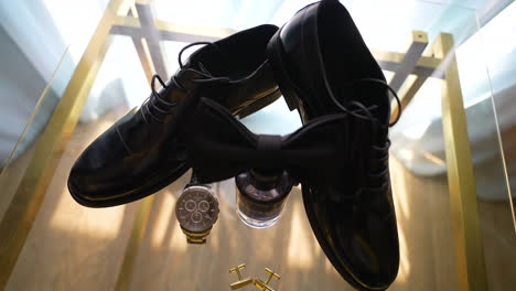 groom's accessories with the bow tie on the table for the wedding day