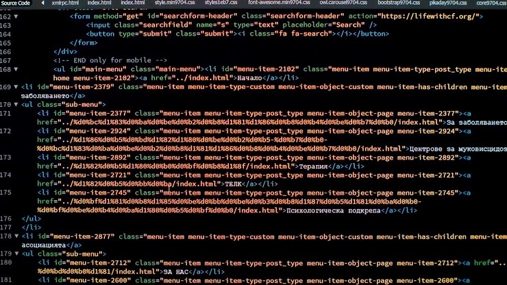 Developer is Browsing HTML Code on the Computer Screen. Front view. HTML Web Page Code Scrolling Programming, Abstract Technology Background for Software Developer, Computer Script Concept. Scene F.