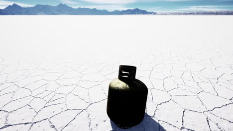 old-rusted-danger-gas-container-on-salt-lake