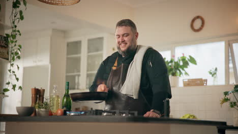 man cooking in kitchen