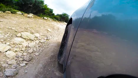 The-view-from-the-camera-mounted-on-the-jeep-on-an-off-road-trip-through-the-country-side-slow-motion-60-fps