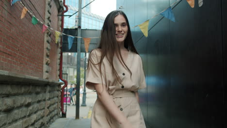 woman walking in a city alleyway