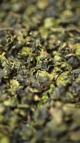 close up of dried green tea leaves