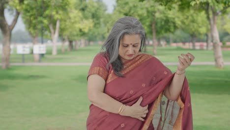 Happy-Indian-old-woman-getting-ready-in-park