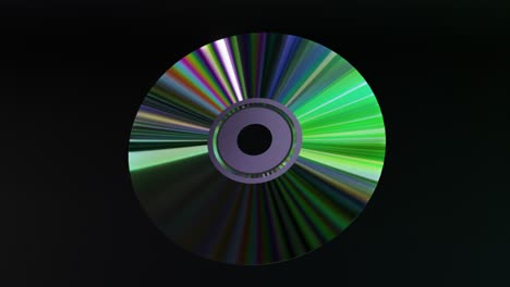 Abstraktes-Konzept:-Die-CD-DVD-Dreht-Sich-Auf-Schwarzem-Hintergrund,-Regenbogengrüne-Neonfarbe,-3D-Animation