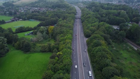 titling drone shot of cars passing on motorway