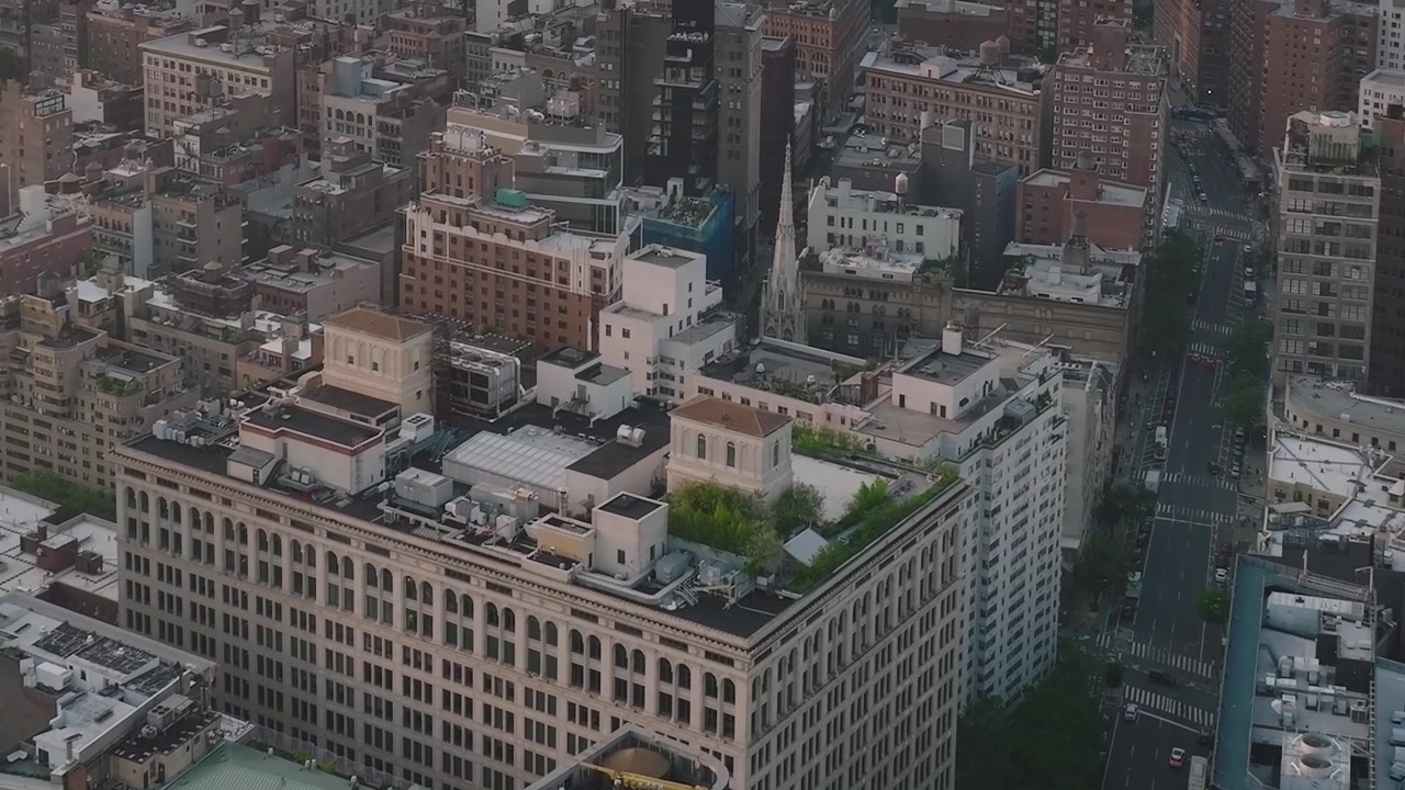 View of buildings in New York City skyline during evening light