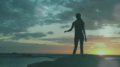 young caucasian woman looking at a sunset