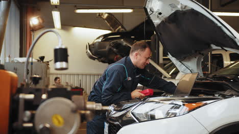 auto mechanic working on a car in a repair shop