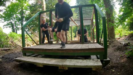 fit man climbing monkey bars 4k