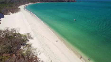 Aerial-Drone-Over-Popular-Conchal-Beach-Costa-Rica-With-Inland-Lake,-4K