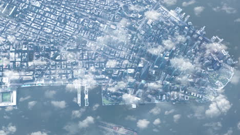 aerial view of a modern city with clouds and water