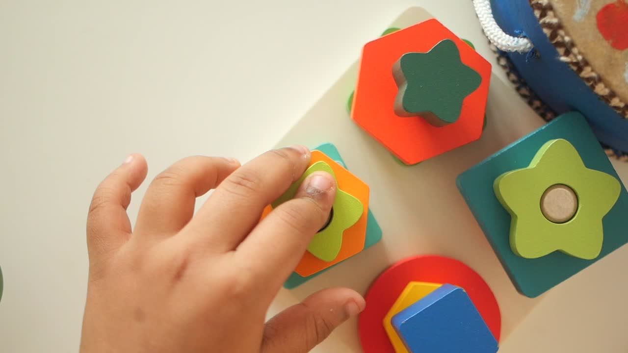 Toddler Playing with Wooden Shape Sorter