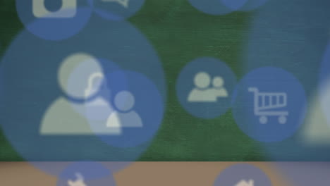 animation of multiple digital icons floating against blackboard in background