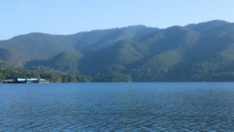 calm water with mountain backdrop over time