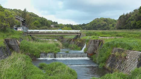 rural japan, pullback reveal of farmlands and river, nawa-gawa tottori japan