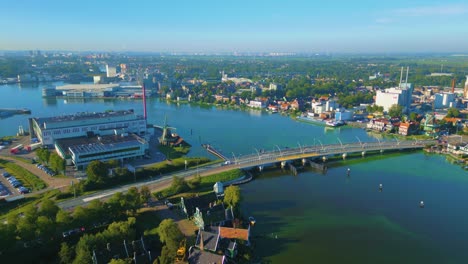 Aerial-view-of-fly-over-bridge-on-the-Zaan-River-at-the-Zaanse-Schans,-Netherlands---historical-village-in-background