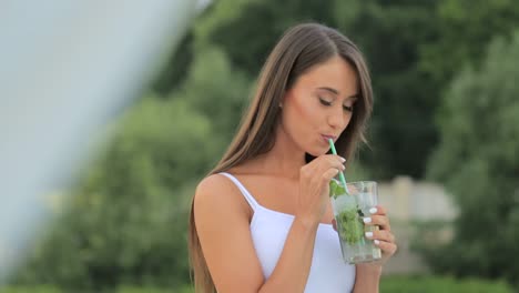 young beautiful stylish girl drinks a cocktail beautiful brunette young beautiful stylish girl drinks a cocktail beautiful brunette