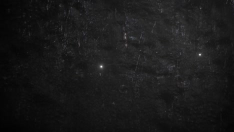 rain and fly particles on dark wall texture