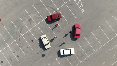 a parade of retro cars of the same brand. aerial view with a circle overfly