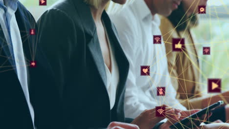 Animation-of-communication-network-over-happy-caucasian-businesswoman-and-colleagues-using-computers