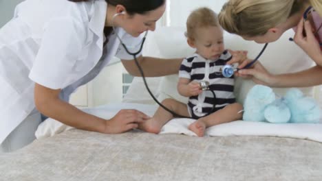 hospital personnel with a baby