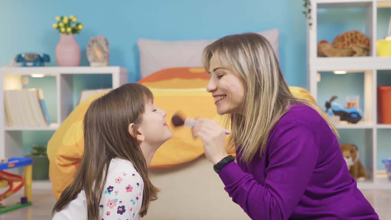 Mom Puts Makeup On Her Curious Little Cute Daughter. Funny And Cute ...