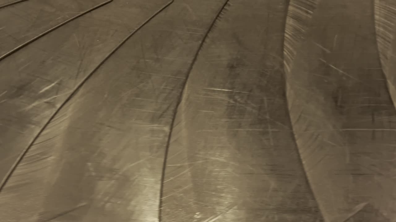 bags and suitcases move along conveyor belt in the baggage reclaim hall at the airport